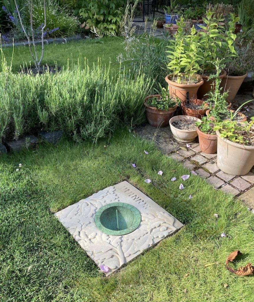 Carved Stone with inset cast bronze hemispherical dial