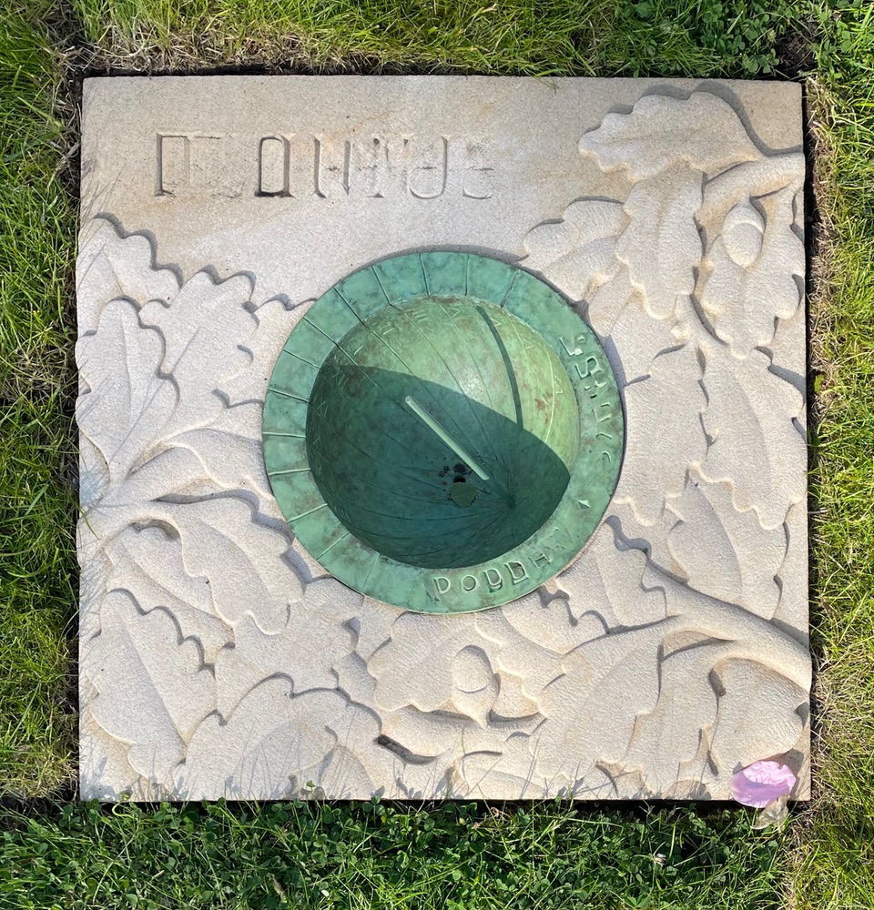 Carved Stone with inset cast bronze hemispherical dial