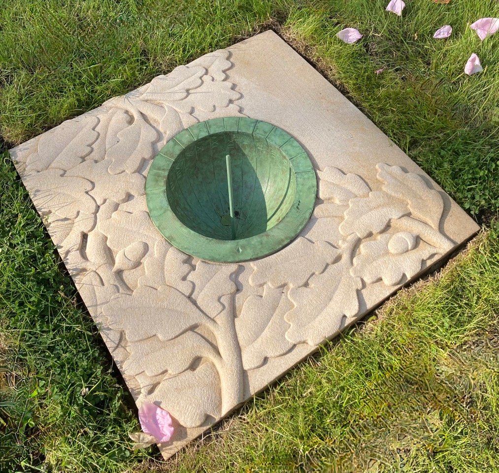 Carved Stone with inset cast bronze hemispherical dial